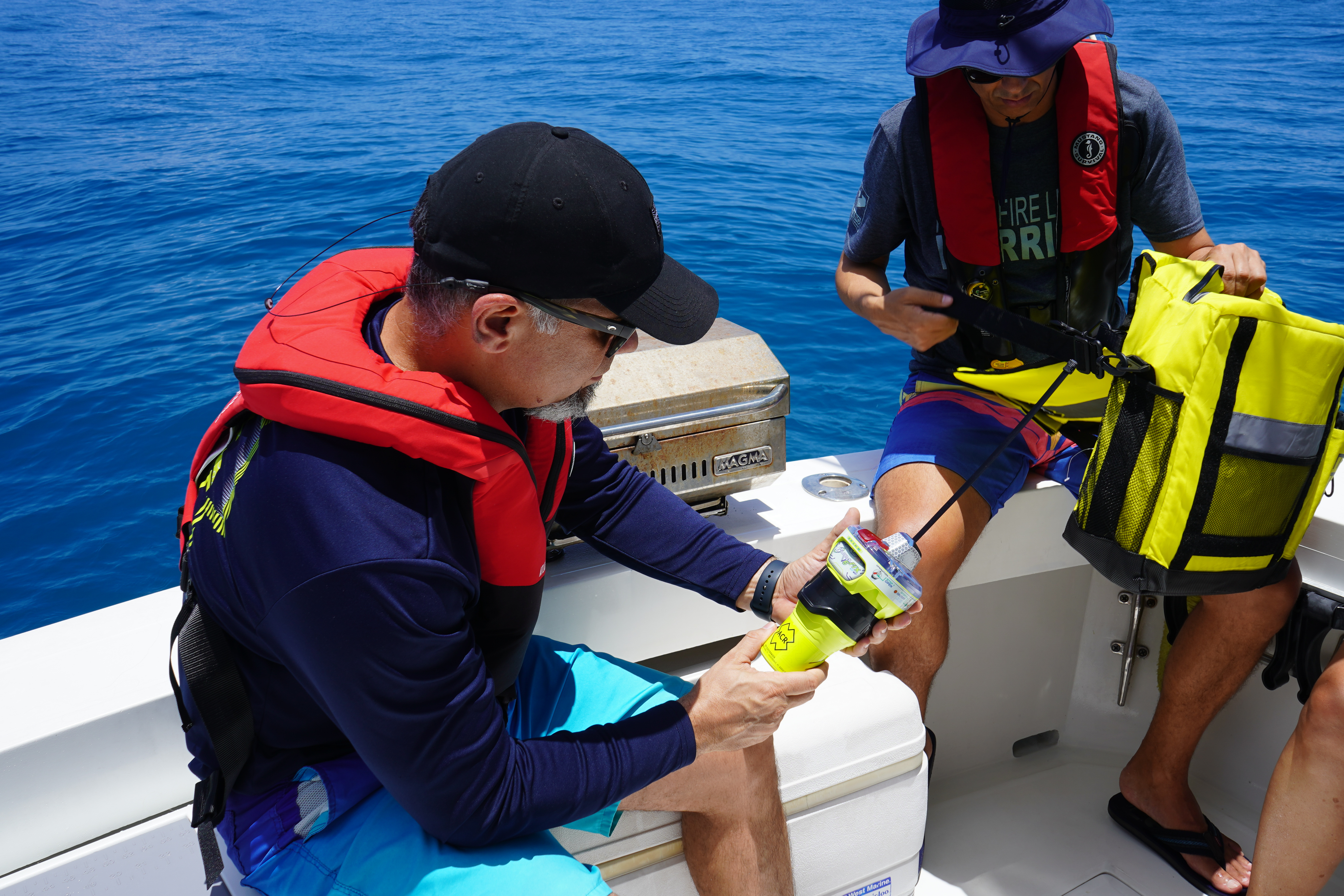 ACR GlobalFix EPIRB held in a hand