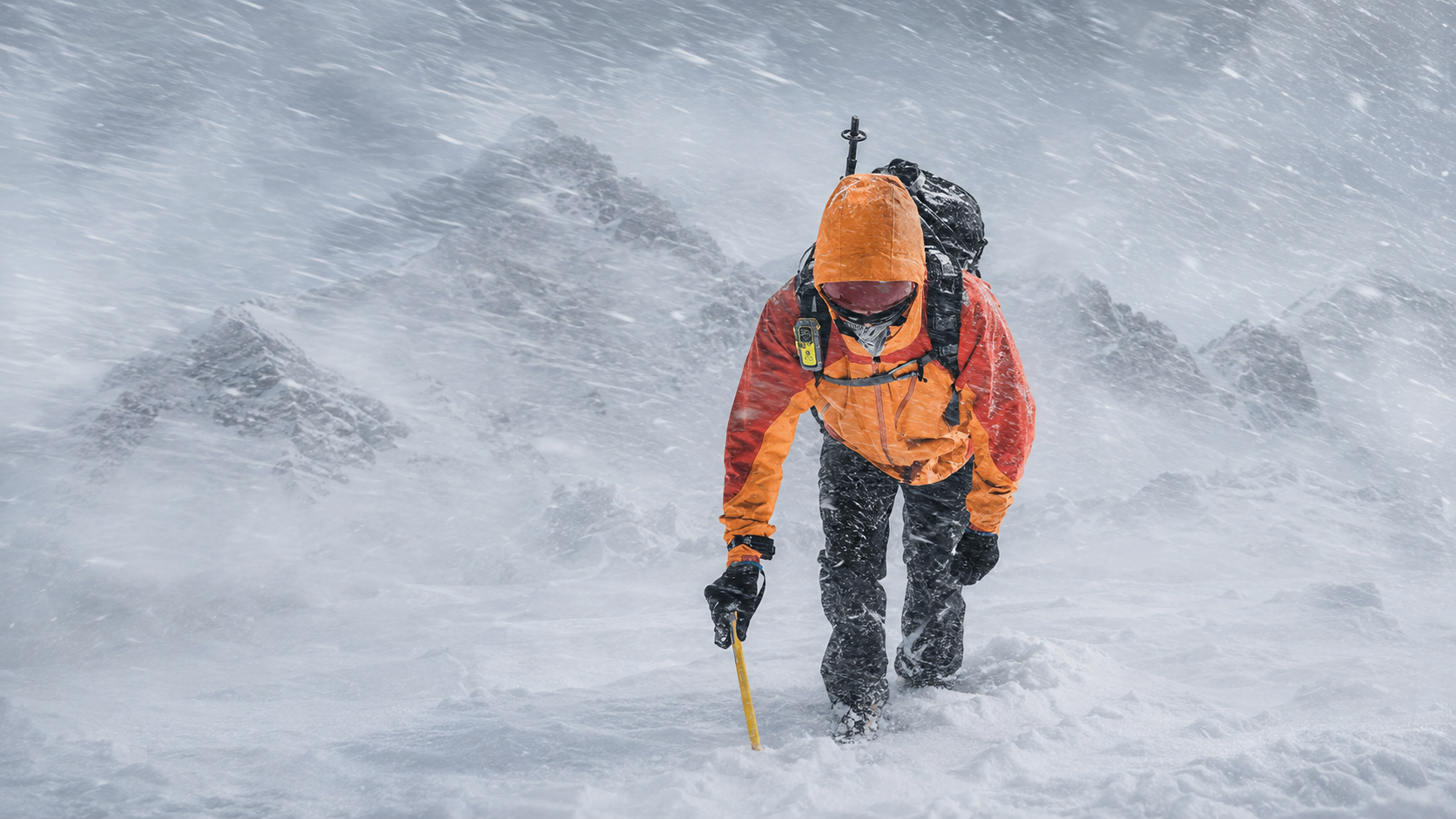 Mountaineer carrying an ACR ResQLink 400 personal locator beacon while battling a severe whiteout in the Canadian Rockies